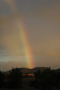 rainbow between two mountains